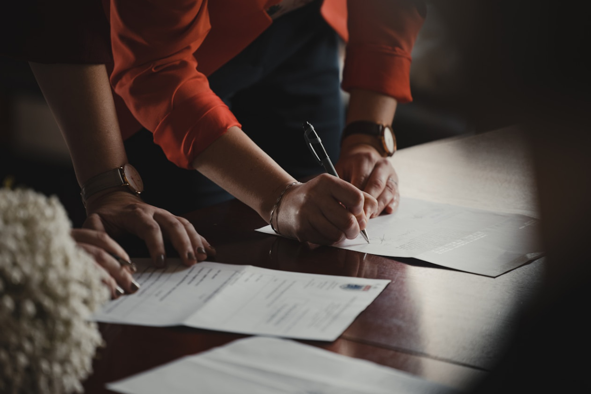 A legal document being signed at a table